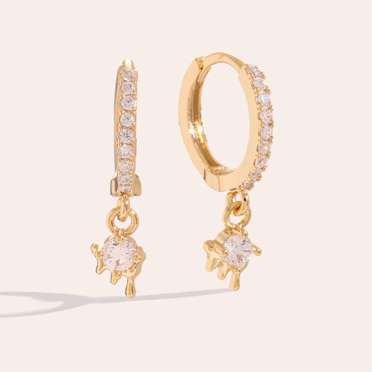 Stilvolle Melt Gloss Ohrringe, die deinem Outfit eine glänzende Note verleihen.