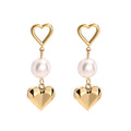 Pearl & Heart Ohrstecker mit einer eleganten Perle und Herzmotiv für einen besonderen Look.